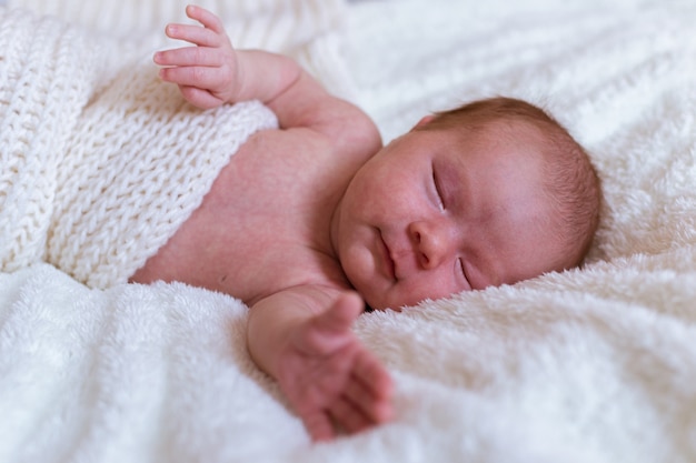 Infant baby portrait in white