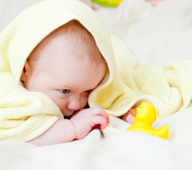 Infant playing with rubber duck