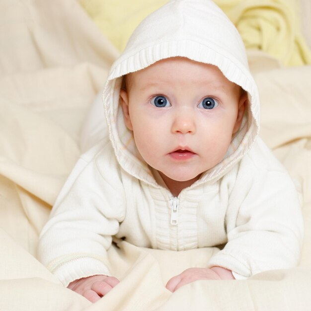 Infant wearing hood