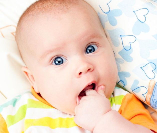 Infant with hand in mouth