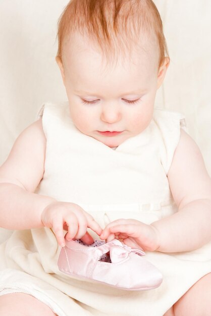 Infant with shoe