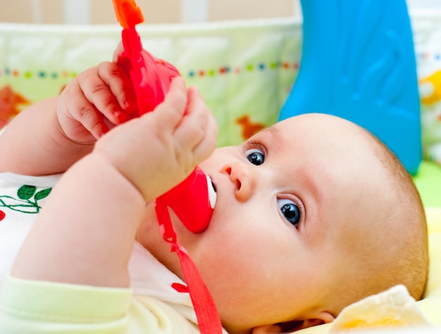 Infant with teething toy