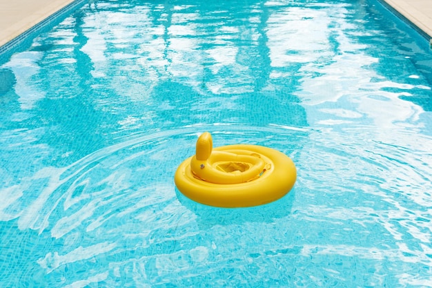 Inflatable baby float ring in openair swimming pool