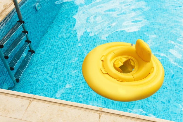 Inflatable baby float ring in openair swimming pool