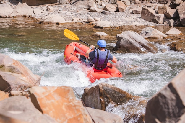 Inflatable raft extreme sport at mountain river summertime copy space