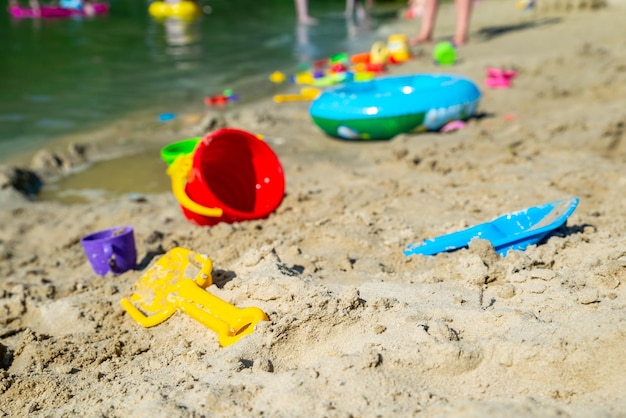 Inflatable ring kids toys at sand beach close up nobody