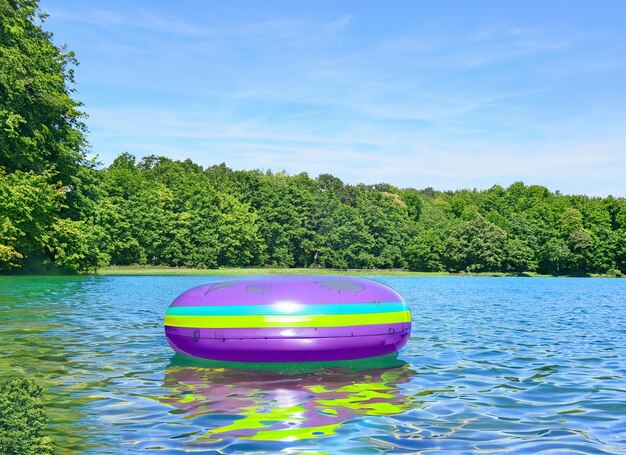 An inflatable swimming ring on top of still lake water surface at sunset ai generated