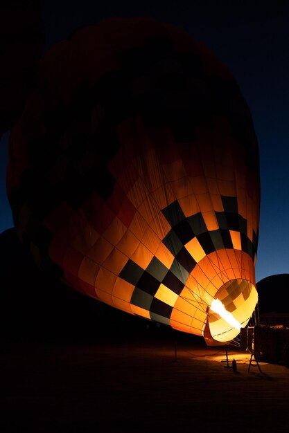 Inflating the balloon with fire at the sunrise to take off and see all of Cappadocia from the sky