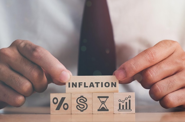 INFLATION word on block stacking as step stair with sign percent and arrow up symbol Interest rate financial and mortgage rates concept