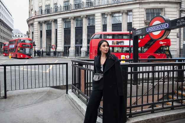 Influencer staying by the entrance of public subway