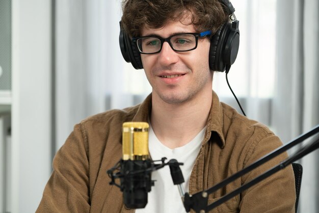 Influencer using headphone talking with listeners on social media Gusher