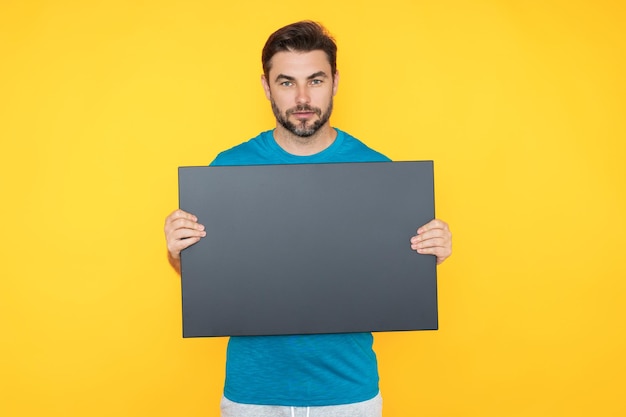 Information concept man with blank placard demonstrating copy space for your text or design man show