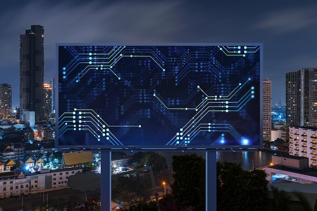 Information flow hologram on road billboard night panorama city view of Bangkok The largest technological center in Southeast Asia The concept of programming science