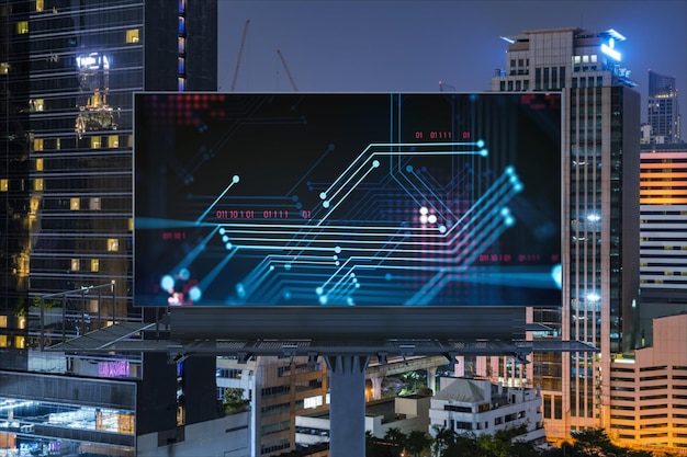 Information flow hologram on road billboard night panorama city view of Bangkok The largest technological center in Southeast Asia The concept of programming science