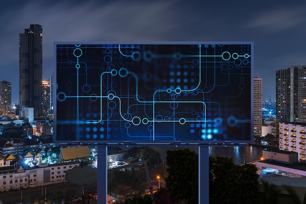 Information flow hologram on road billboard night panorama city view of Bangkok The largest technological center in Southeast Asia The concept of programming science