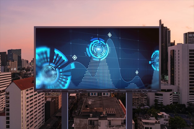 Information flow hologram on road billboard night panorama city view of Bangkok The largest technological center in Southeast Asia The concept of programming science