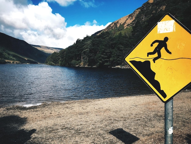 Photo information sign by lake