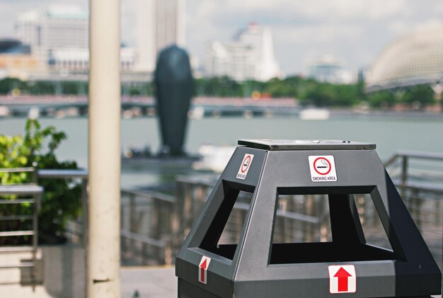 Photo information sign by river in city