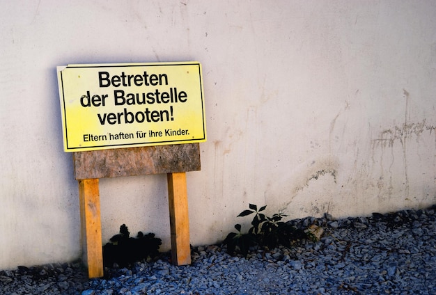 information sign by wall