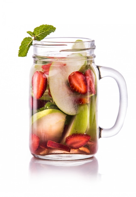 Infused fresh fruit water apple, strawberry and mint. isolated o