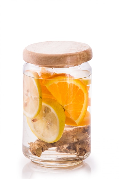 Infused fresh fruit water of orange, citrus and ginger.isolated