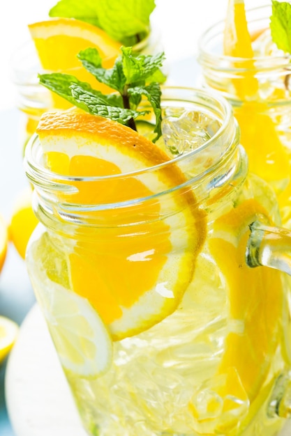 Photo infused water with fresh citrus fruits and ice.