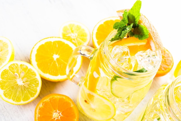 Infused water with fresh citrus fruits and ice.