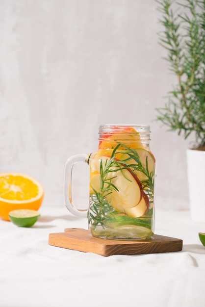 Infused water with lime, orange, apple and rosemary.