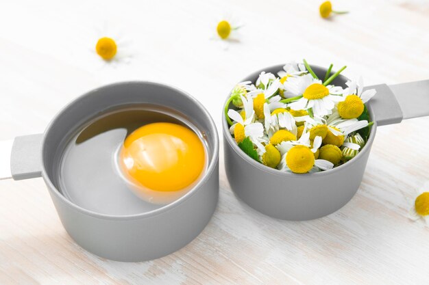 Ingredient for natural homemade cosmetics Egg and chamomile for hair care