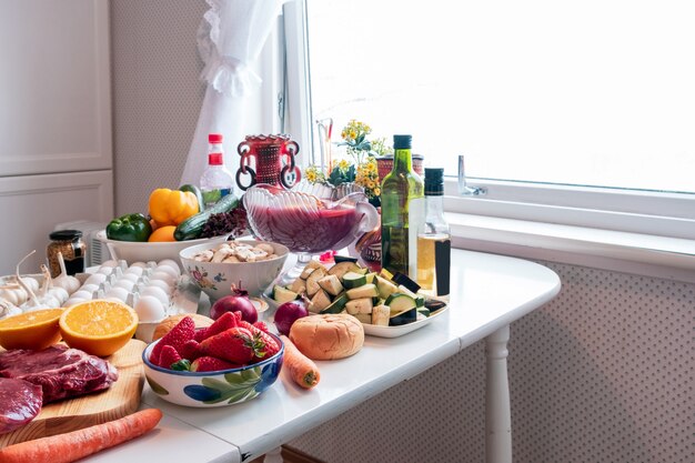 Ingredient with many foods, vegetables, fruits preparing for dinner on the dining table