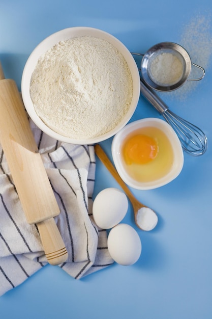 Ingredients for baking on blue background