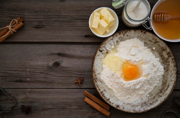 ingredients for baking cookies dough on wodden backgroun