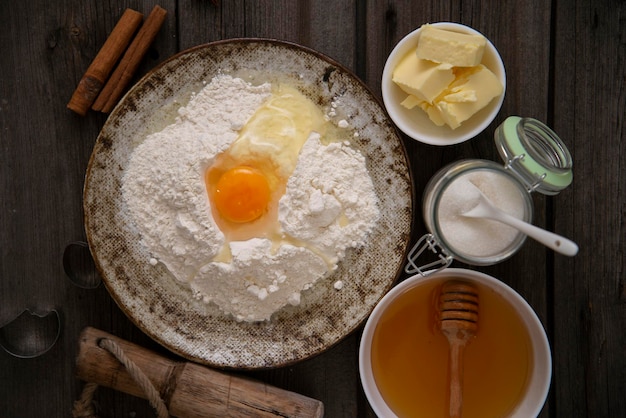 ingredients for baking cookies dough on wodden backgroun