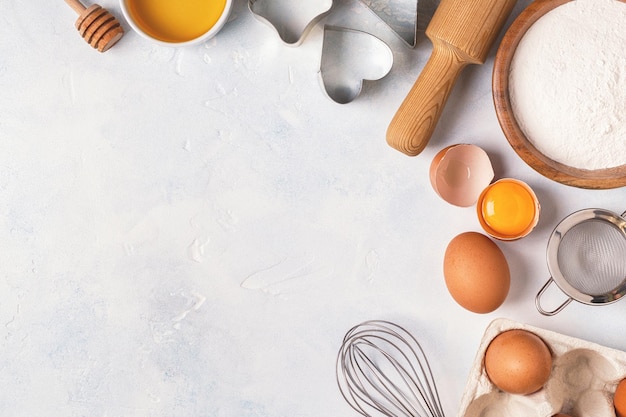 Ingredients for baking flour wooden spoon eggs