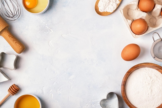 Ingredients for baking flour wooden spoon eggs