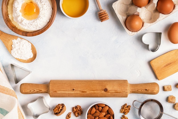 Ingredients for baking flour wooden spoon eggs