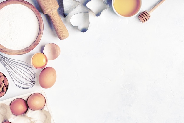 Ingredients for baking flour wooden spoon eggs