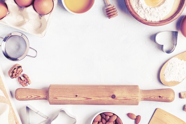 Ingredients for baking flour wooden spoon eggs