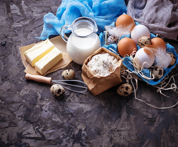 Ingredients for baking. Milk, butter, eggs, flour. Selective focus