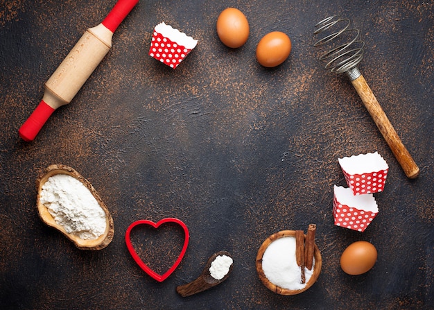 Photo ingredients for baking on rusty background