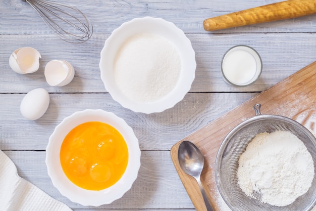 Ingredients for baking on a white wooden table