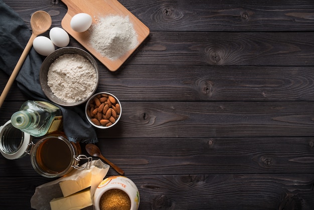 Ingredients for baking on a wooden table top view