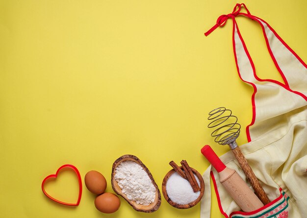 Ingredients for baking  on yellow background