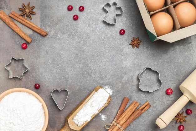 Ingredients for cooking Christmas baking on dark rustic baking tray