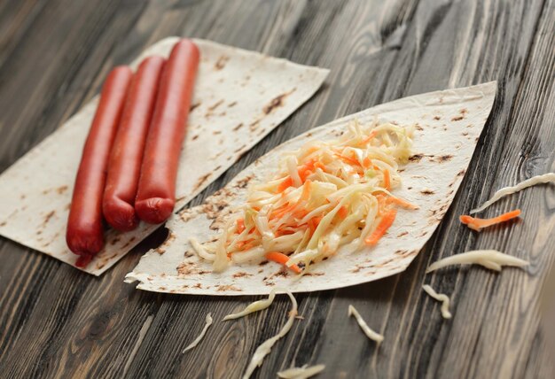 Ingredients for cooking kebabs on a dark wooden background