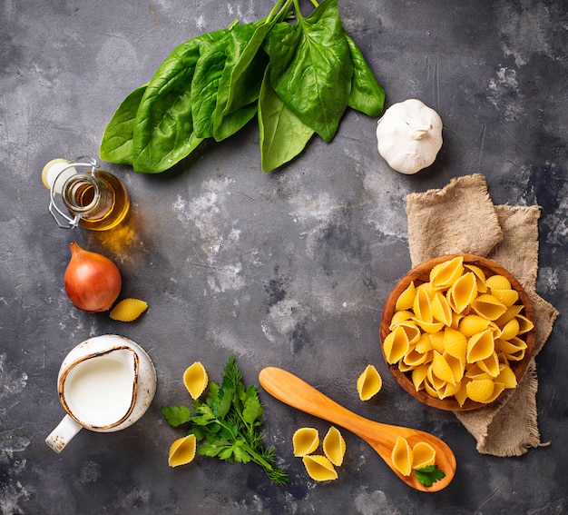 Ingredients for cooking  pasta with spinach 