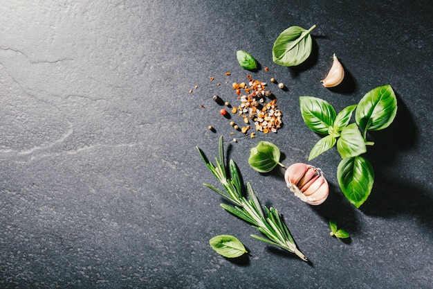 Ingredients for cooking placed on dark background.