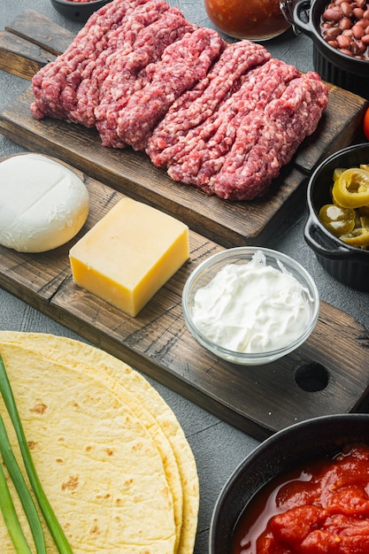 Ingredients for cooking quesadillas, on gray background