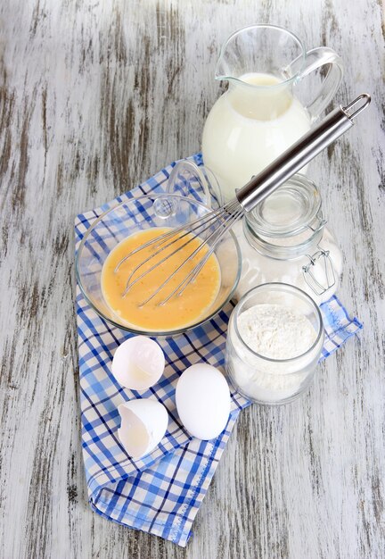 Photo ingredients for dough on wooden table close-up