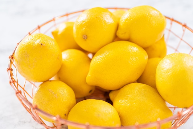 Ingredients in glass mixing bowls to prepare lemon bundt cake.